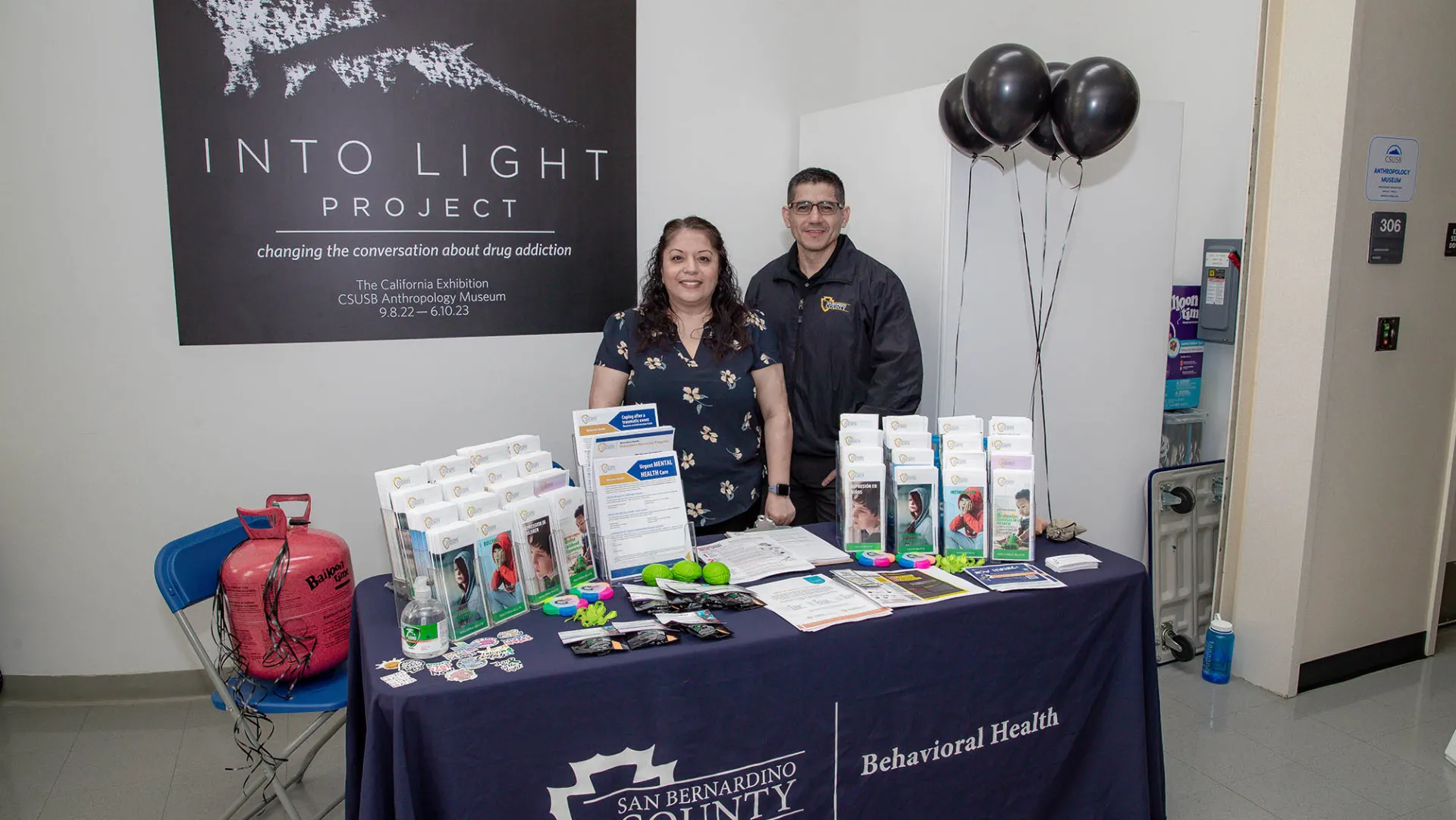 San Bernardino County Social Services staff members Monica Rosas (left) and Daniel Mendez met with students, staff and faculty in CSUSB’s Anthropology Museum during Black Balloon Day, an event that brought awareness to the dangers of drug overdoses and substance use disorder.