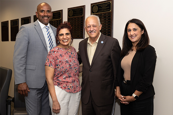 From left, Provost Rafik Mohamed; 2023-24 Golden Apple Award recipient and professor of psychology, Manijee Badiee; CSUSB President Tomás D. Morales; Christina Hassija, dean of the College of Social and Behavioral Sciences.