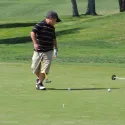 Kid playing golf