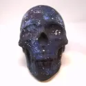 Matte black painted skull with blue, purple and white swatches to compose a space/galaxy pattern.