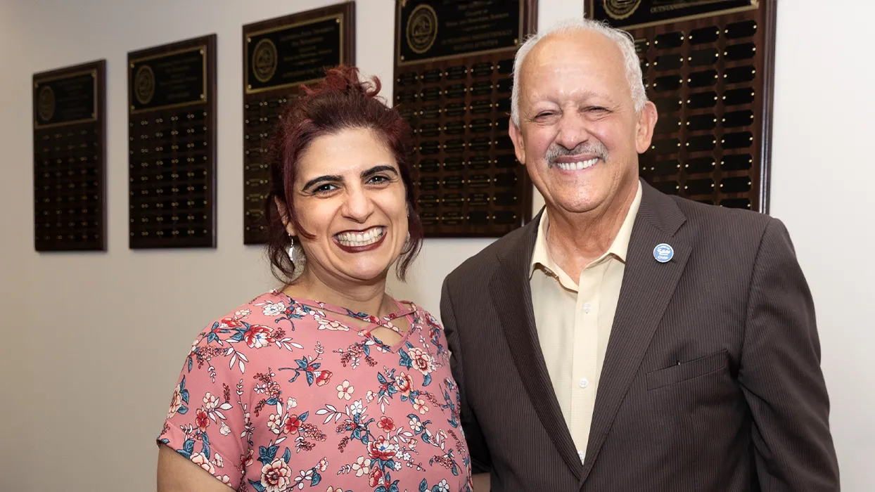 From left, Manijeh Badiee, recipient of the 2023-24 Golden Apple Award, and CSUSB President Tomás D. Morales