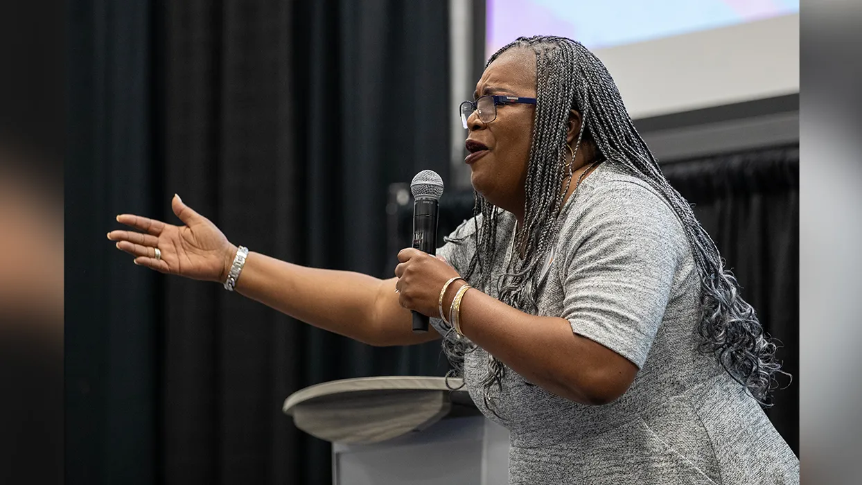 Kim Carter speaking on stage during CSUSB’s Womxn’s Leadership Conference on March 22. 