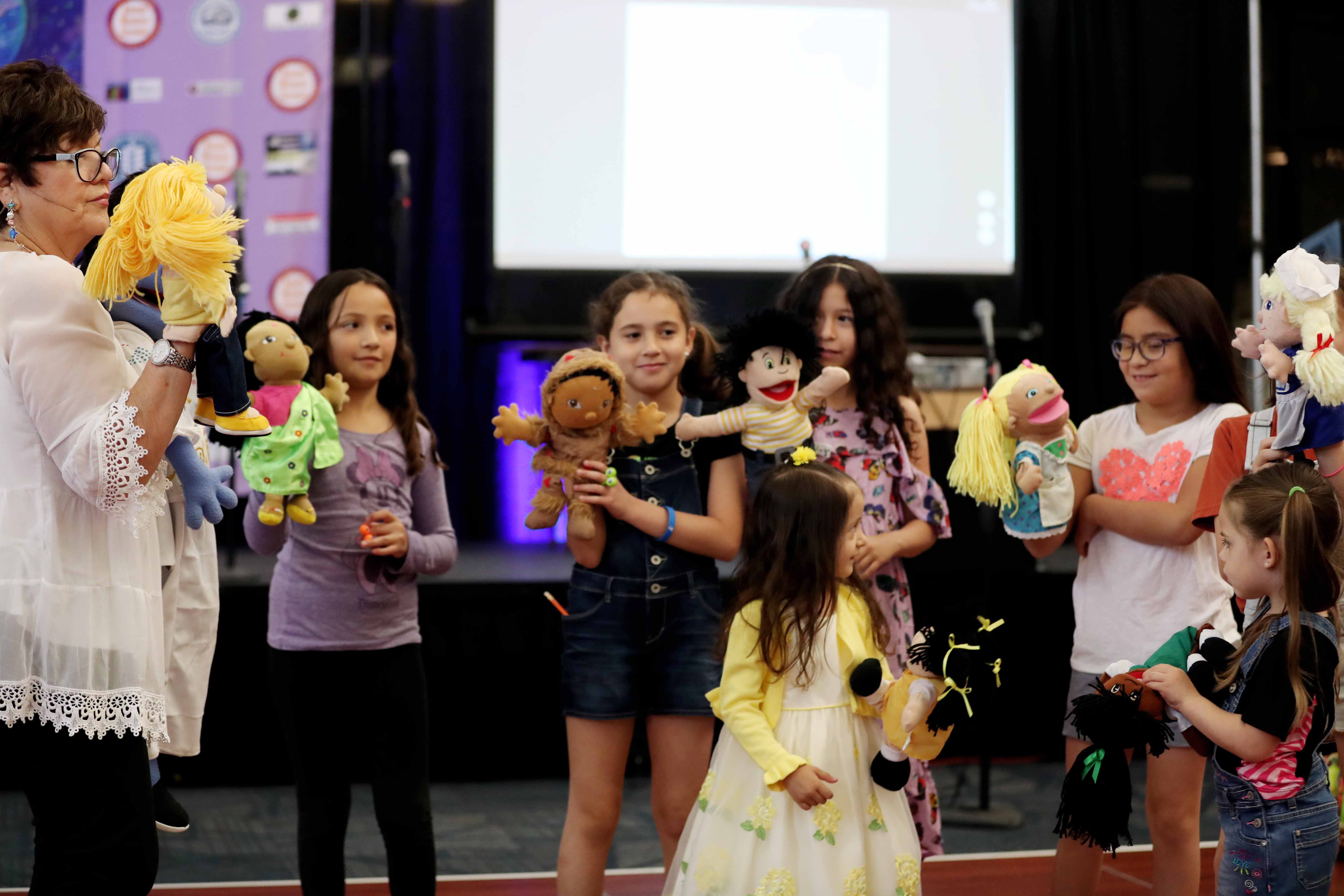 The book festival included activities such as puppetry.