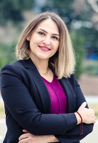 Dr. Melika Kordrostami in Purple and Black