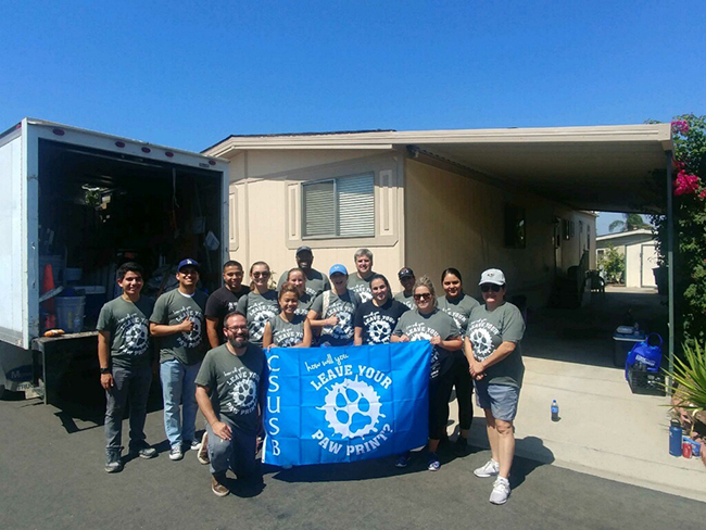 Group photo taken in front of the mobile home we were revitalizing.