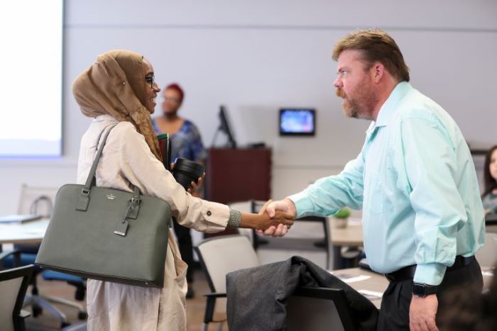 Faculty greeting each other at the Opening Program in the FCE