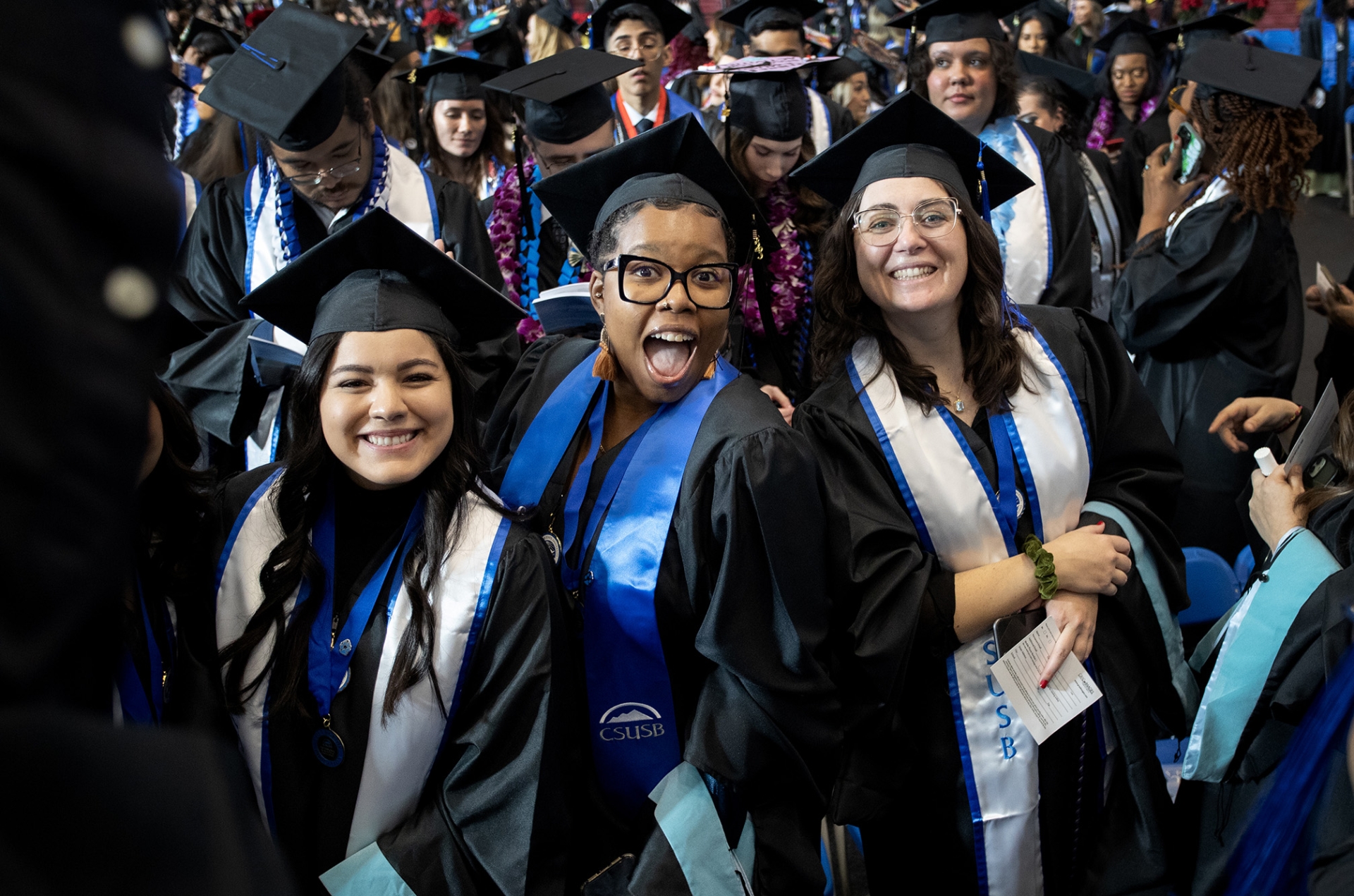 Graduates are all smiles at the commencement ceremony for the College of Arts & Letters and James R. Watson & Judy Rodriguez Watson College of Education.