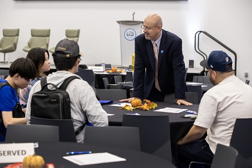 JHBC Dean Tomas Gomez-Arias with students