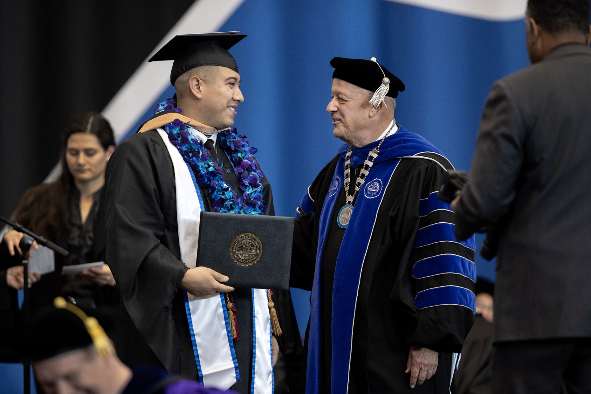 CSUSB President Tomás D. Morales congratulates a graduate of Jack H. Brown College of Business and Public Administration.