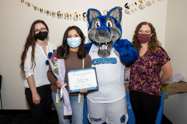 Stacy Morris, Cody the Coyote, Emely Lugo, and Amanda Wilcox-Herzog