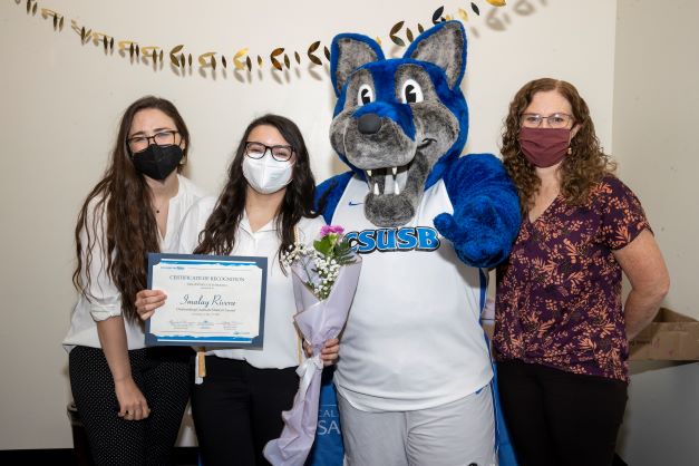 Stacy Morris, Cody the Coyote, Imalay Rivera, and Amanda Wilcox-Herzog