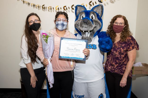 Stacy Morris, Cody the Coyote, Vanessa Popoca, and Amanda Wilcox-Herzog