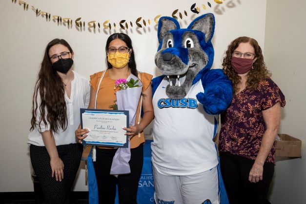 Stacy Morris, Cody the Coyote, Pauline Rocha, and Amanda Wilcox-Herzog