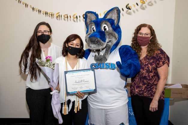 Stacy Morris, Cody the Coyote, Anabell Ramos, and Amanda Wilcox-Herzog