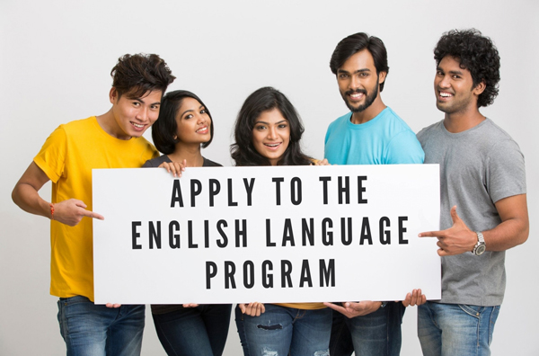 Students Holding Sign Saying "Apply to the English Language Program"