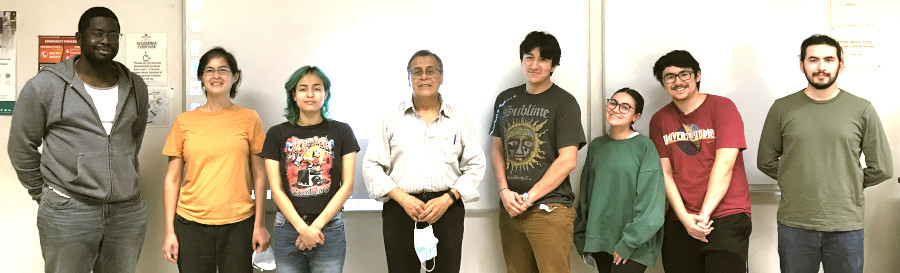 People standing in front of a whiteboard