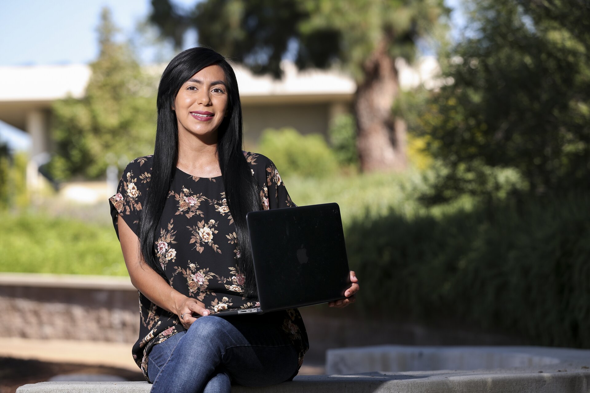 Student posing with computer