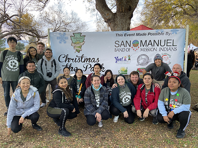 Group photo of CSUSB students at the Christmas In The Park.