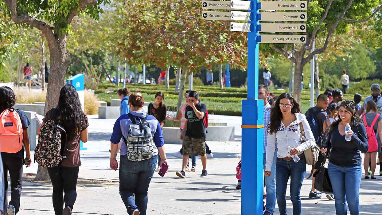 Students waling through CSUSB campus