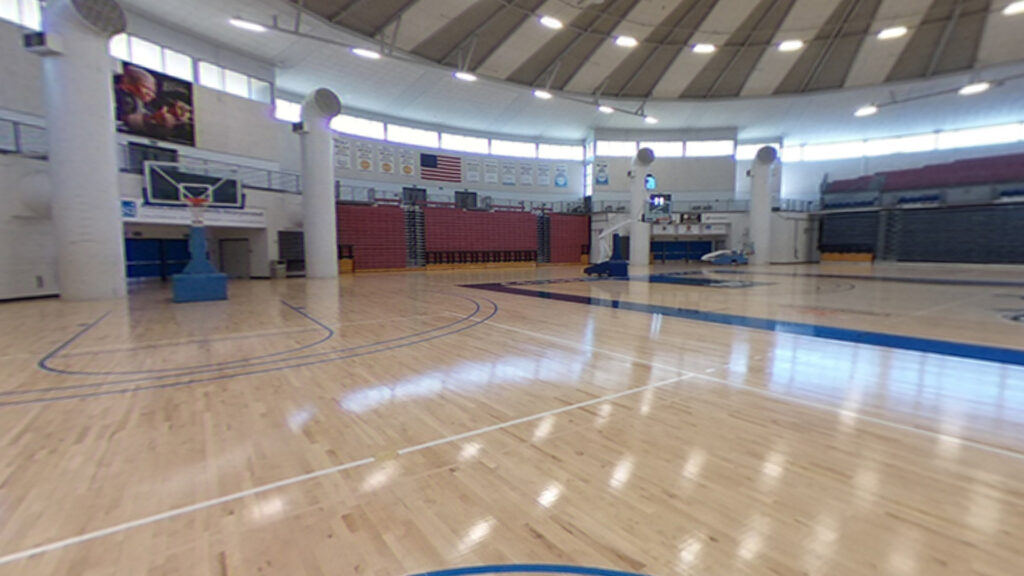 Coussoulis Arena basketball court bleachers and net