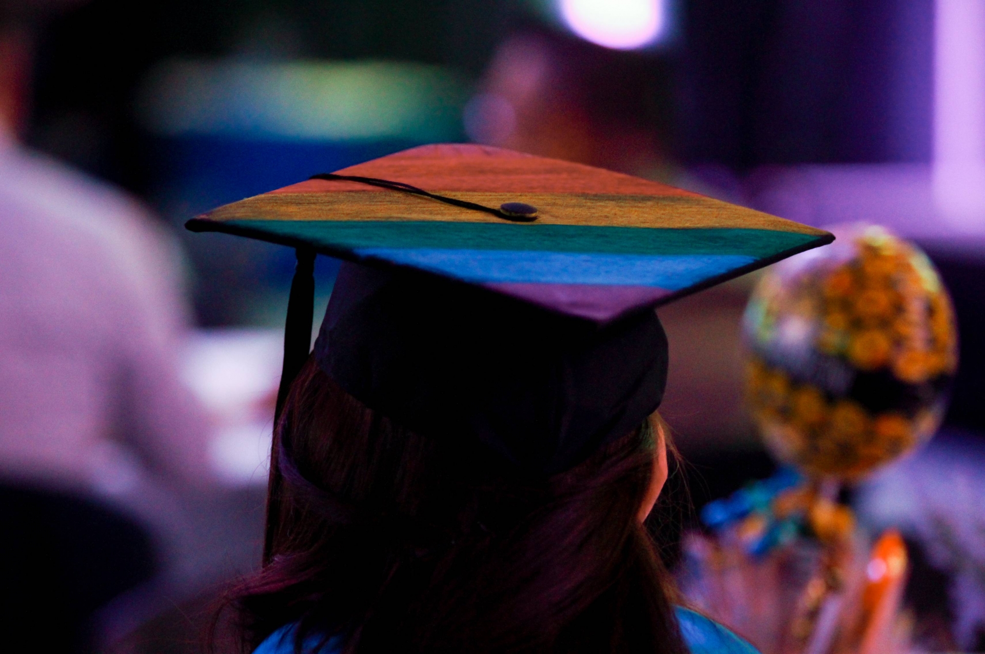 Pride flag on a mortar board of a student