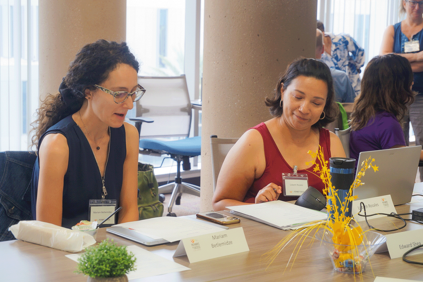 This image teachers working together at the table