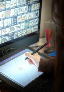 Student drawing on a tablet