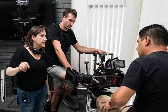 Lane Shefter Bishop (center, with the headphones) on the set of “Blood, Sweat and Lies.” Photo: Ashly Covington 