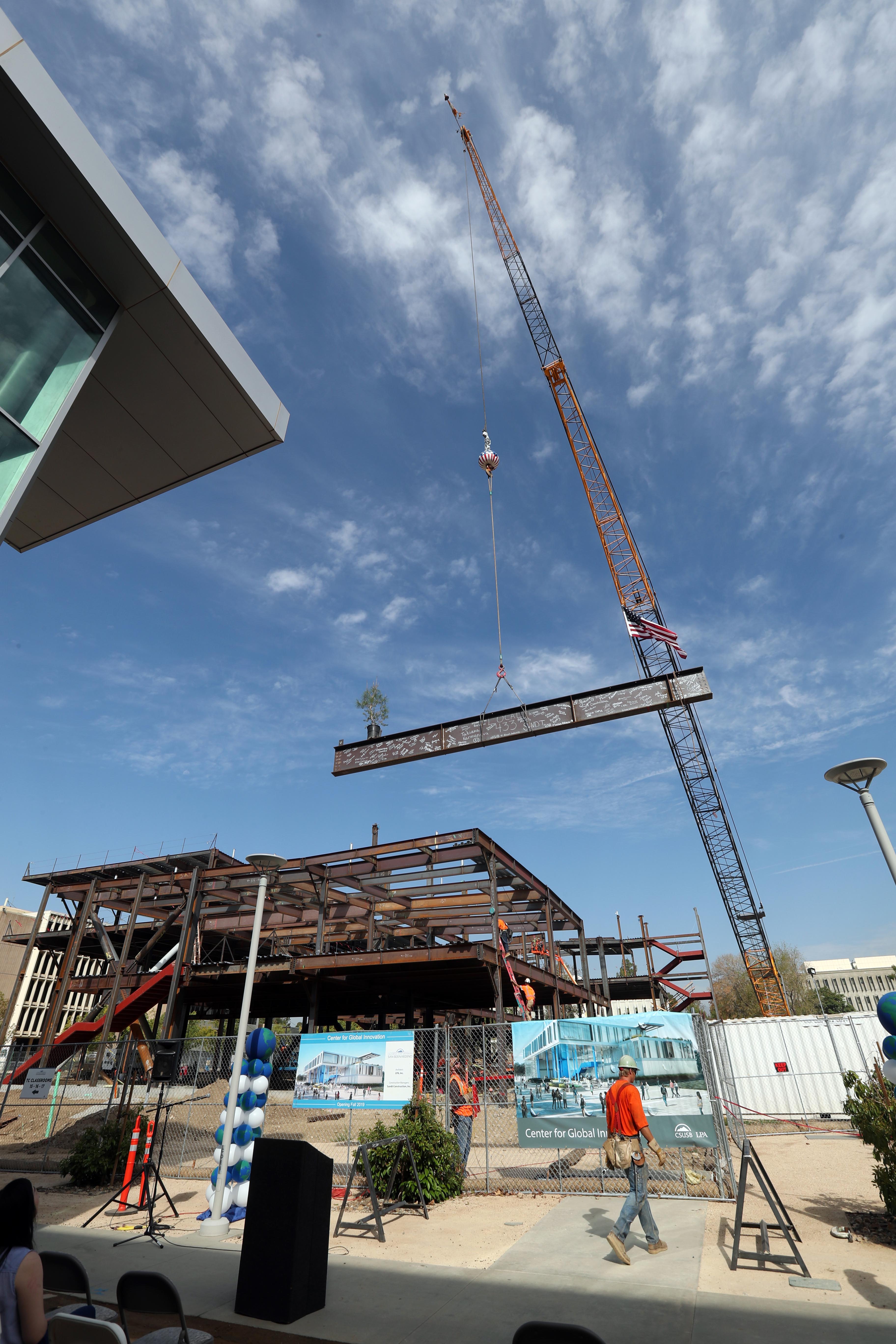 The “topping out” ceremony is a tradition that commemorates the achievement of the ironworkers who are the first workers to reach the top of the structure.  