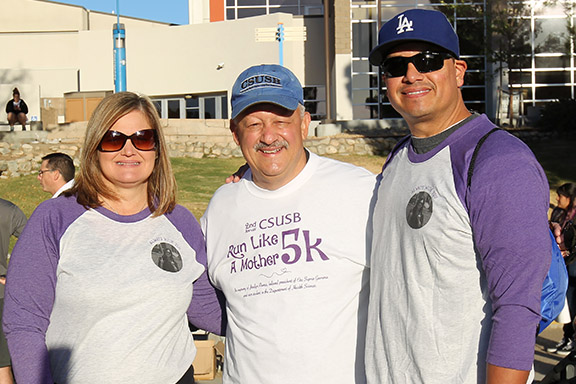 Jordyn Rivera’s parents, Mary (left) and Albert Rivera (right), with CSUSB President Tomás D. Morales at the second annual Run Like a Mother 5k . Photo: Ayah Khairallah/CSUSB