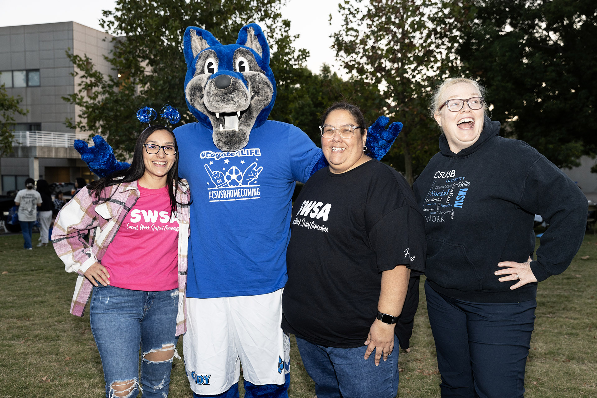 Cody the Coyote poses with Homecoming Bash guests