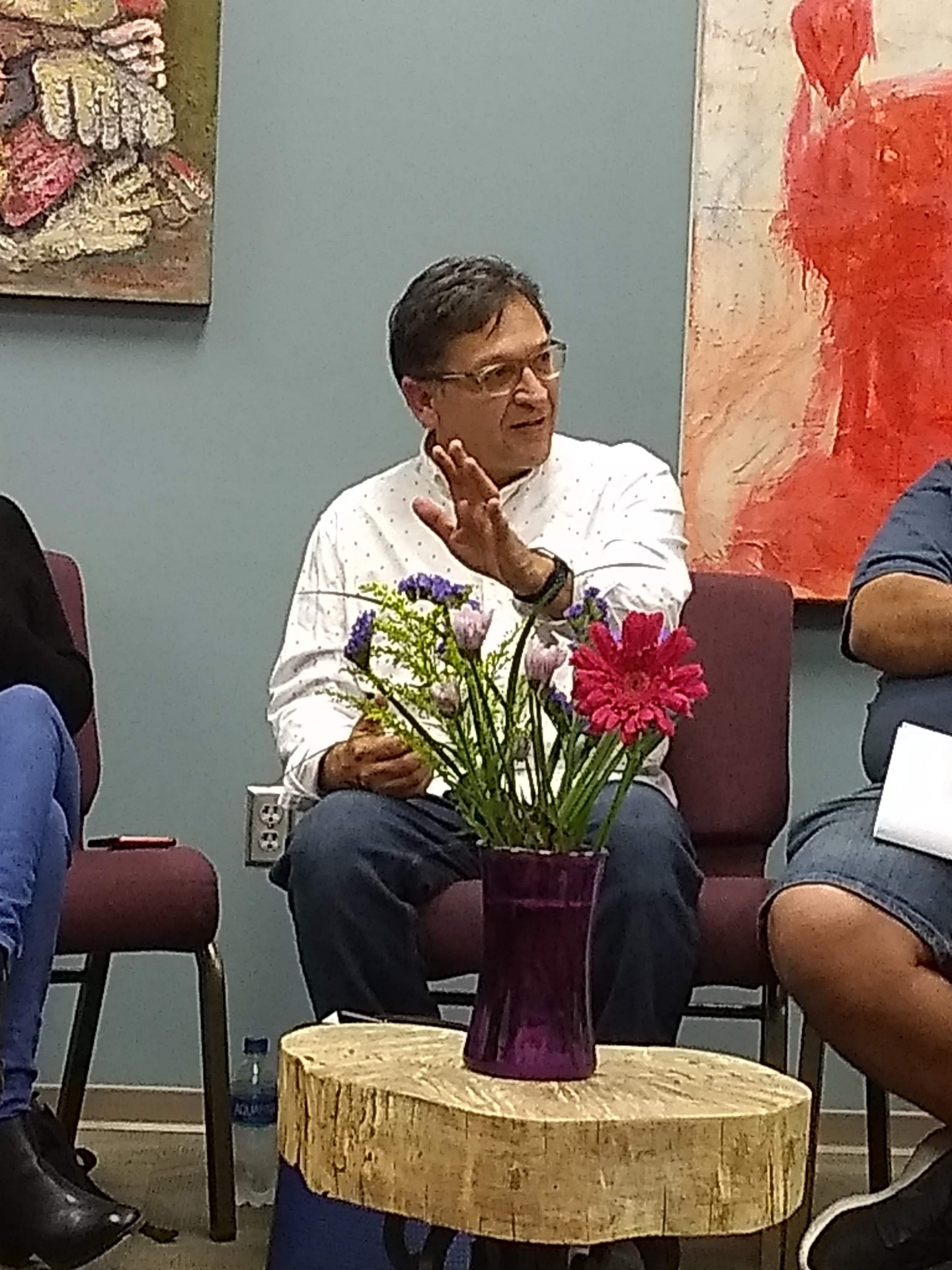 Professor Juan Delgado with white shirt, glasses and dark brown hair