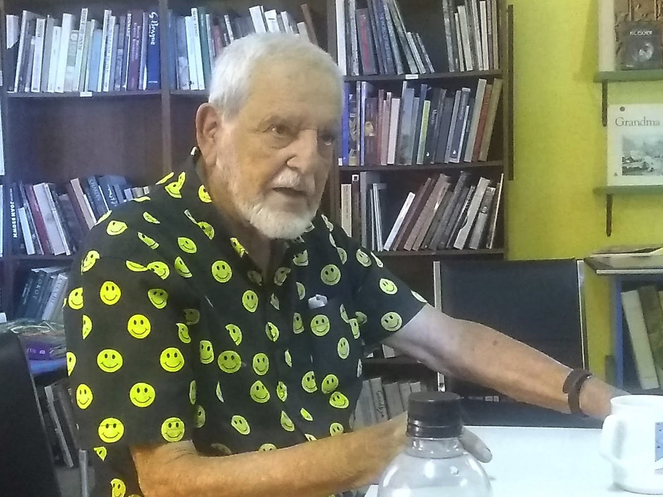 Dr. Ernest Garcia, black shirt with yellow smiley faces and silver hair