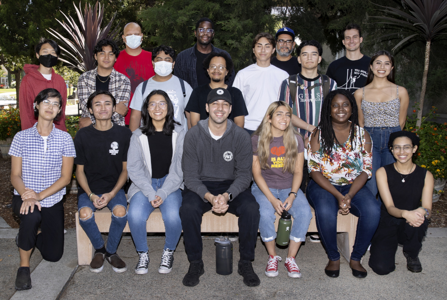 LSAMP participants sitting and standing in front of foliage