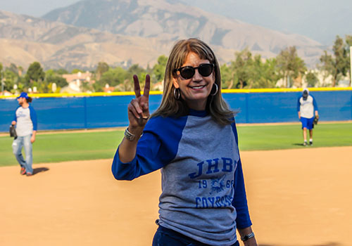 Marketing Department Chair playing softball