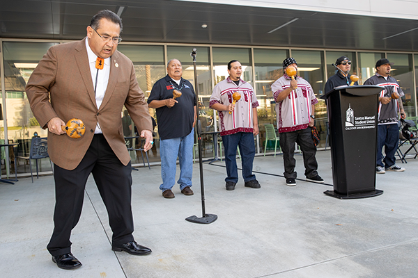 Assemblymember James Ramos performing with the Torres Martinez Desert Cahuilla Indian bird singers 