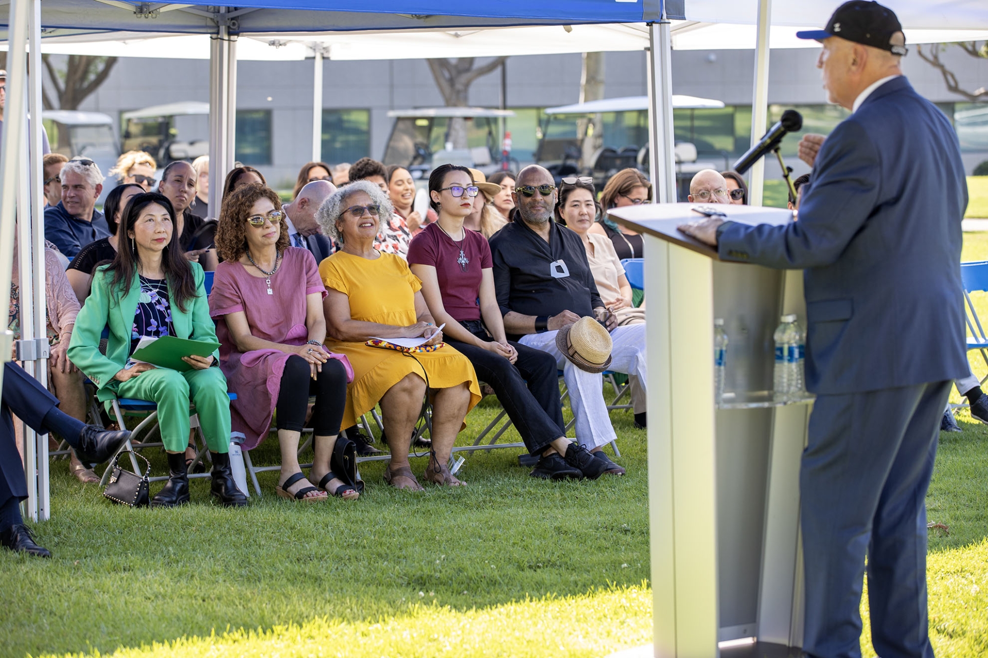 Robert Nava speaks to the audience during the Topping Out Ceremony.