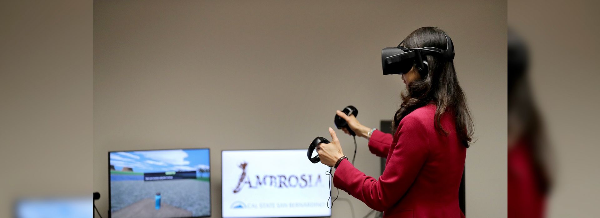 Rueyling Chuang, interim dean of CSUSB’s College of Arts &amp; Letters, tries out a virtual reality computer program created by the Immersive Media &amp; Learning Lab.