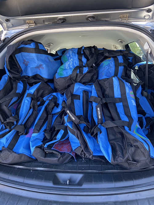 Decorated duffel bags donated to foster care kids in Coachella Valley.
