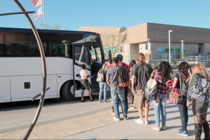 People getting on a bus