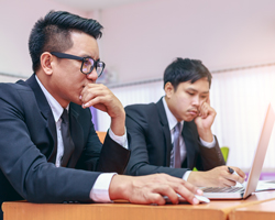 Young foreign businessmen studying English