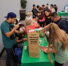 Students exploring tables at Heritage Month Celebration