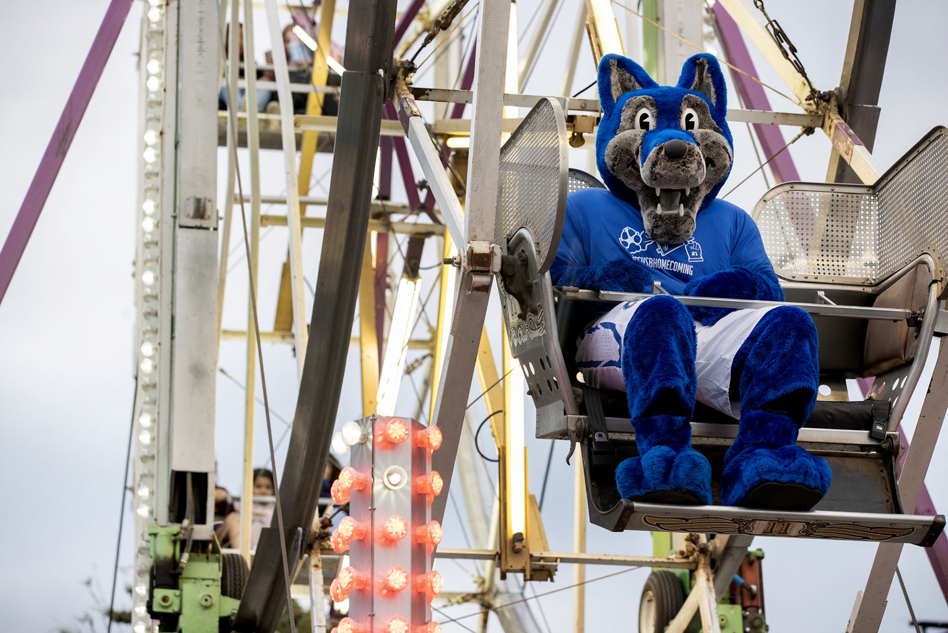 Cody the Coyote takes a spin on the Ferris wheel at the Homecoming Bash