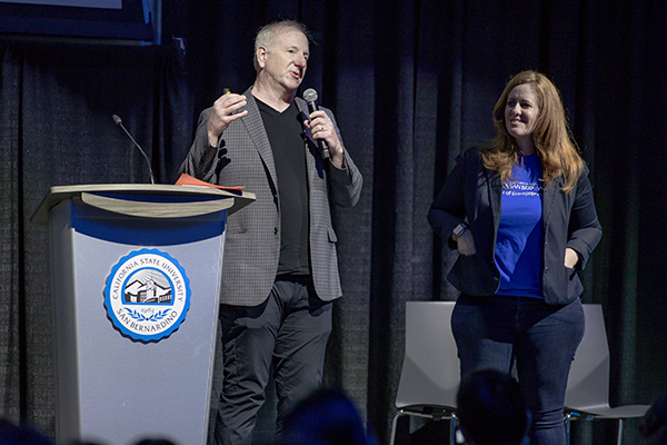 Mike Stull, director of IECE and professor of entrepreneurship, and Stacy Allis, IECE assistant director, speak to students at 2023 Virtual Enterprise International – West Coast Regional Tradeshow, Competition and Exhibition.