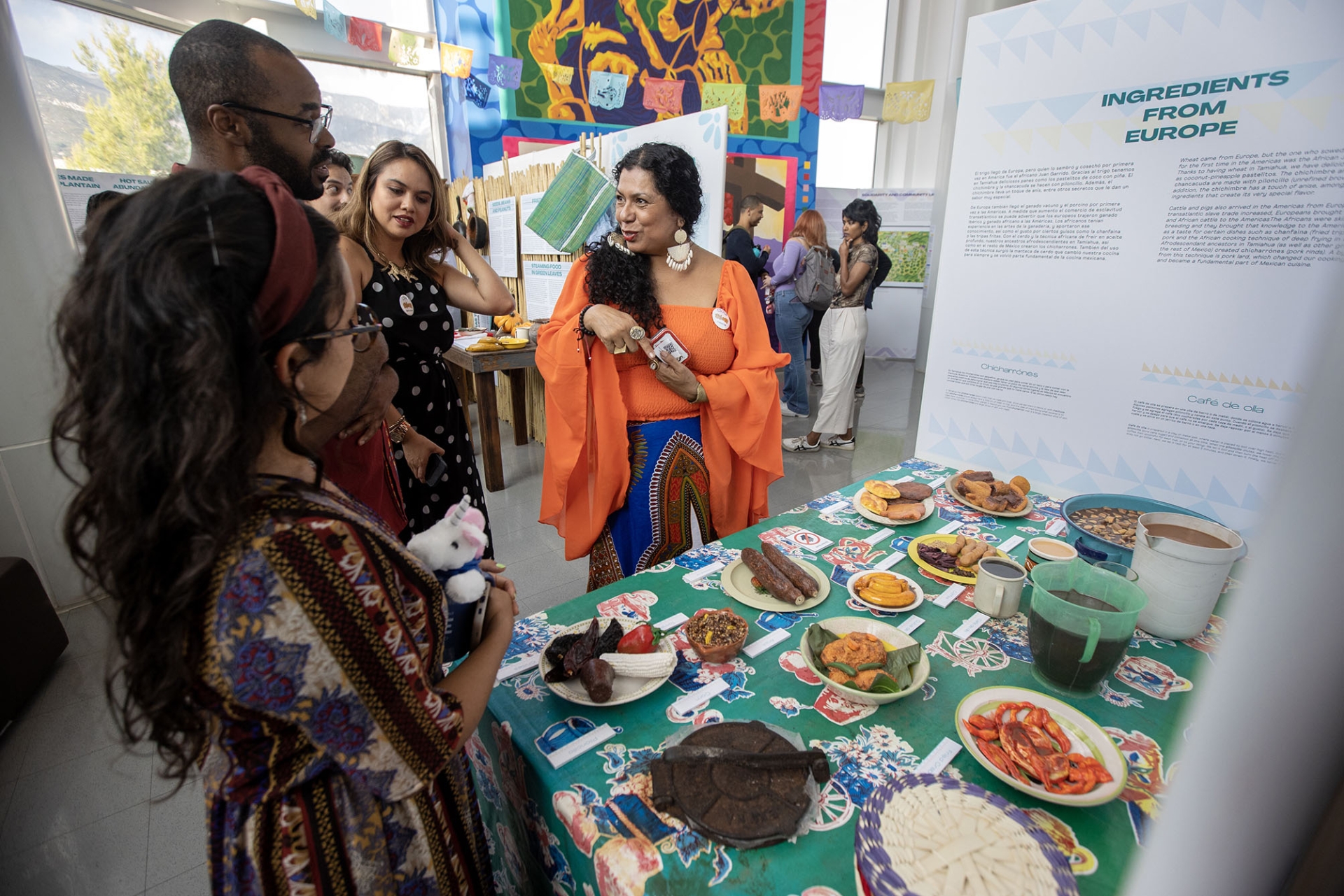Doris Careaga-Coleman (right), lead curator for the Tamiahua section of Afróntalo, explains the merging of the African and Latino culinary heritage of the region’s food.
