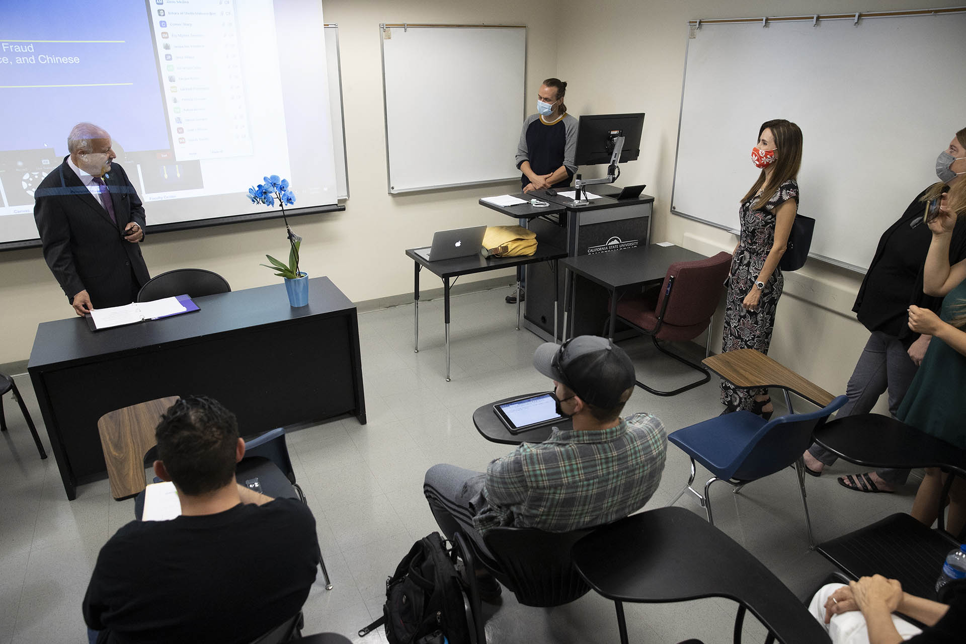 The faculty "ambush" led by university President Tomás D. Morales and fellow faculty in a class taught by Jeremy Murray, associate professor of history, to announce that hi is the 2022 Outstanding Faculty Advisor.