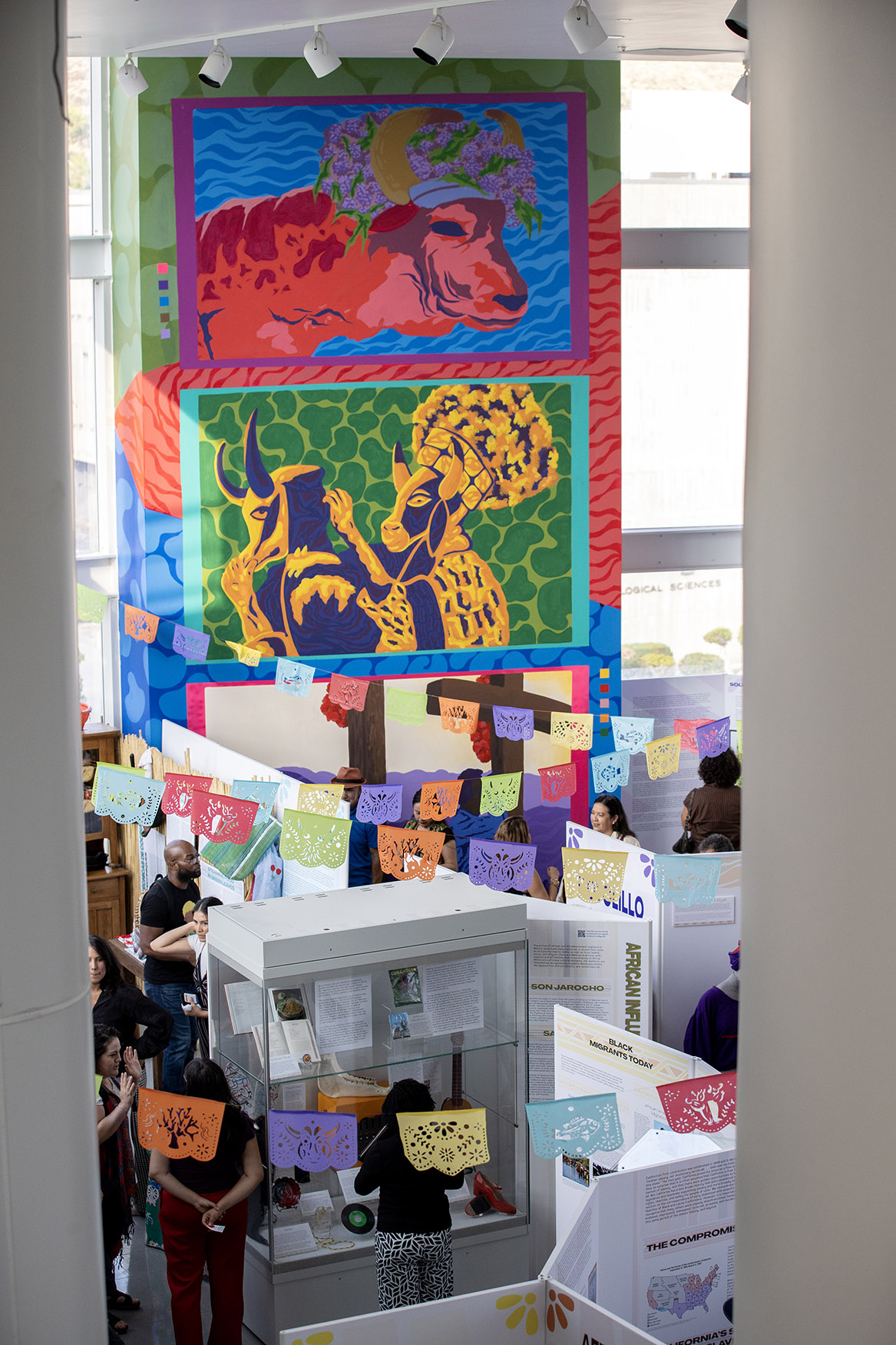 The mural painted by painted by Julio “Honter” Antuna Lopez looks over the Afróntalo exhibit at the CSUSB Anthropology Museum