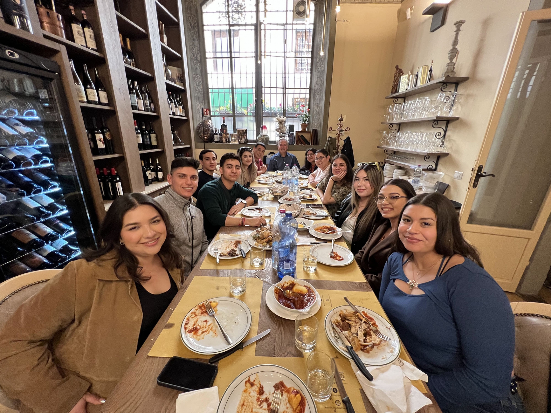 CSUSB hospitality management students share a meal during their trip to Italy.