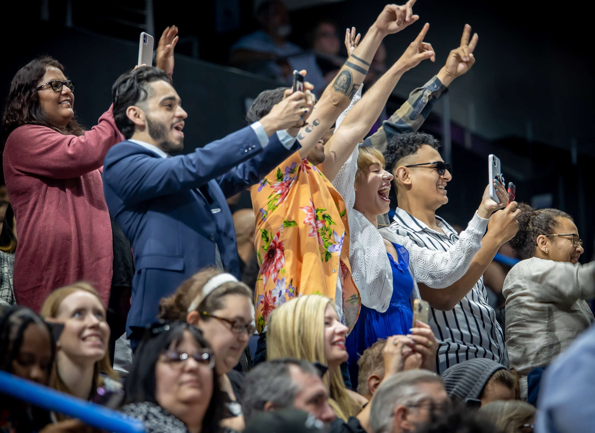 Family and friends celebrate from the stands, cheering on graduates from the College of Arts and Letters and James R. Watson & Judy Rodriguez Watson College of Education during their ceremony on May 20.