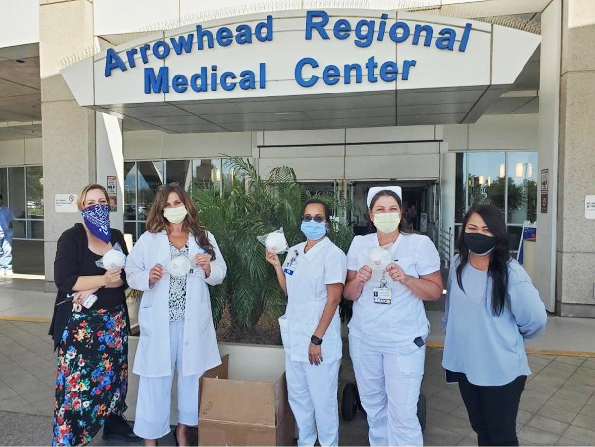 Nurses receiving masks from CSUSB students